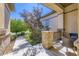 Inviting covered porch with brick pillars and stucco siding, with charming outdoor seating at 15975 Quandary Loop, Broomfield, CO 80023