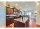 Well-equipped kitchen featuring granite countertops, hardwood floors, and modern stainless appliances at 15975 Quandary Loop, Broomfield, CO 80023