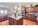 Open kitchen featuring granite countertops, stainless appliances, and seamless access to breakfast area at 15975 Quandary Loop, Broomfield, CO 80023