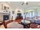 Comfortable living room featuring a fireplace, built-ins, and elegant decor at 15975 Quandary Loop, Broomfield, CO 80023