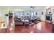 Spacious living room with hardwood floors, a fireplace, and large windows at 15975 Quandary Loop, Broomfield, CO 80023