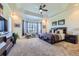 Spacious main bedroom features tray ceilings, a bay window, and plush carpeting at 15975 Quandary Loop, Broomfield, CO 80023