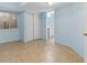 Finished basement area with tile flooring, closet, and convenient access to a bathroom at 7234 E 38Th Ave, Denver, CO 80207