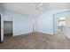 Bright, airy bedroom featuring fresh paint, ceiling fan, and walk-in closet at 7234 E 38Th Ave, Denver, CO 80207