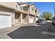 Charming townhome with a private garage, inviting entrance, and well-maintained landscaping at 7234 E 38Th Ave, Denver, CO 80207