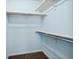 Spacious walk-in closet with ample shelving for optimal organization and storage at 7234 E 38Th Ave, Denver, CO 80207
