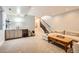 A finished basement with a bar, lounge area, and staircase at 3188 W 28Th Ave, Denver, CO 80211
