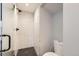 This bathroom features a glass shower with unique tiling and a black shower head and handle at 3188 W 28Th Ave, Denver, CO 80211