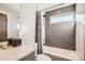 Clean, neutral bathroom with a shower-tub, and nice vanity with open mirror, offering practicality and style at 3188 W 28Th Ave, Denver, CO 80211