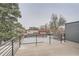 This deck overlooks neighboring houses with views of some trees at 3188 W 28Th Ave, Denver, CO 80211