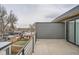 This deck overlooks other houses and a fenced backyard with grass at 3188 W 28Th Ave, Denver, CO 80211
