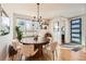 Bright dining room featuring a modern light fixture, hardwood floors, and stylish decor at 3188 W 28Th Ave, Denver, CO 80211