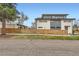 Modern multi-level home with gray and white exterior, sleek lines, and fenced yard at 3188 W 28Th Ave, Denver, CO 80211