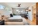 Bright main bedroom with large windows, hardwood floors, and a stylish ceiling fan at 3188 W 28Th Ave, Denver, CO 80211