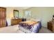 Bright bedroom with a bed, dresser, and window offering plenty of natural light at 4056 E Orchard Rd, Centennial, CO 80121