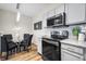 Bright kitchen with breakfast nook and modern finishes at 10805 Twenty Mile Rd # 203, Parker, CO 80134