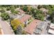 Aerial view of a townhouse community with lush trees and well-maintained grounds at 3210 S Oneida Way, Denver, CO 80224