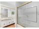 Well-lit bathroom featuring updated fixtures and tile work at 3210 S Oneida Way, Denver, CO 80224