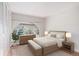 Stylishly decorated bedroom with a large arch window at 3210 S Oneida Way, Denver, CO 80224