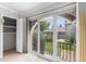 The bedroom includes a large sliding glass door with an adjacent storage closet with shelving at 3210 S Oneida Way, Denver, CO 80224
