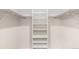 Bright walk-in closet includes built-in shelving and closet rods at 3210 S Oneida Way, Denver, CO 80224