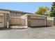 View of the exterior with a garage and nice landscaping, showcasing curb appeal and convenient parking at 3210 S Oneida Way, Denver, CO 80224
