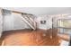 Open floor plan featuring hardwood floors and a staircase, perfect for entertaining guests at 3210 S Oneida Way, Denver, CO 80224