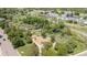 Aerial view of a community playground nestled among trees, offering a Gathering-friendly recreational space at 3210 S Oneida Way, Denver, CO 80224