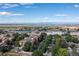 Aerial view of condos near a lake and mountain range at 13950 E Oxford Pl # A115, Aurora, CO 80014