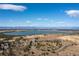 Aerial view of a lake and surrounding landscape at 13950 E Oxford Pl # A115, Aurora, CO 80014