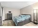 Spacious bedroom with a large bed and plenty of storage at 13950 E Oxford Pl # A115, Aurora, CO 80014