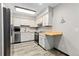 Kitchen with stainless steel appliances and butcher block countertops at 13950 E Oxford Pl # A115, Aurora, CO 80014