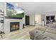 Living room with a fireplace and built-in entertainment center at 13950 E Oxford Pl # A115, Aurora, CO 80014