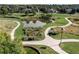 A park with walking paths, landscaping, and a pond at 13950 E Oxford Pl # A115, Aurora, CO 80014