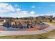 A playground with play structures and a walking path, ideal for families at 13950 E Oxford Pl # A115, Aurora, CO 80014