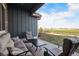 Relaxing covered patio offers comfortable seating and views of the expansive backyard and community at 2882 Heron Lakes Pkwy, Berthoud, CO 80513