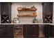 This bar has plenty of cabinet space, a wine cooler, and a beverage cooler at 2882 Heron Lakes Pkwy, Berthoud, CO 80513