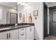 Contemporary bathroom boasts double sinks, granite countertops, and stylish fixtures at 2882 Heron Lakes Pkwy, Berthoud, CO 80513