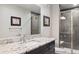 This bathroom includes granite countertops and a glass shower at 2882 Heron Lakes Pkwy, Berthoud, CO 80513