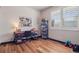 Versatile bedroom with wood floors, perfect for an office or guest space at 2882 Heron Lakes Pkwy, Berthoud, CO 80513