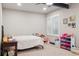 This bedroom has lots of natural light and toy storage at 2882 Heron Lakes Pkwy, Berthoud, CO 80513