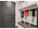 Functional mudroom with built-in bench, storage hooks, and stylish finishes at 2882 Heron Lakes Pkwy, Berthoud, CO 80513