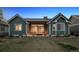 Beautiful backyard of home featuring a covered patio with comfortable seating and serene outdoor space at 2882 Heron Lakes Pkwy, Berthoud, CO 80513