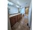 Bathroom featuring double sinks, a soaking tub, and a walk-in shower at 23831 Eagle Bend Ln, Parker, CO 80138