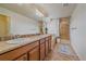 Bathroom features double sinks, a spacious shower with tile surround, and plenty of cabinet space at 23831 Eagle Bend Ln, Parker, CO 80138