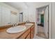 Double vanity bathroom featuring modern faucets and a view into a themed bedroom at 23831 Eagle Bend Ln, Parker, CO 80138