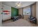 Bedroom with a window view, pegboard wall, modern fan, and unique decor at 23831 Eagle Bend Ln, Parker, CO 80138