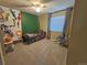 Bedroom featuring a twin bed, custom wall decorations, and a ceiling fan at 23831 Eagle Bend Ln, Parker, CO 80138