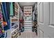 Walk-in closet with clothing racks, built-in shelving, drawers, and space for shoes and accessories at 23831 Eagle Bend Ln, Parker, CO 80138