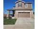 Charming two-story home featuring stone accents, a covered porch, and well-maintained landscaping at 23831 Eagle Bend Ln, Parker, CO 80138